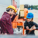 Operator,In,Safety,Helmet,And,Red,Square,Shirt,Receiving,Instruction