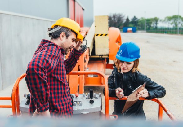 Operator,In,Safety,Helmet,And,Red,Square,Shirt,Receiving,Instruction